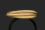 Bracelet rigide 

en or jaune 750 millièmes, composé de trois...